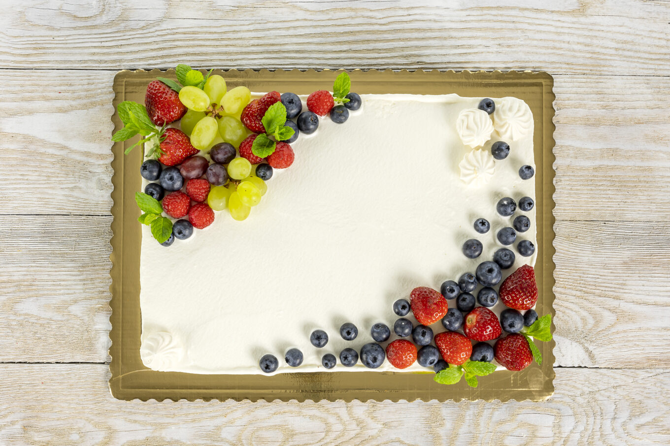 rectangular communion cake decorated with fruit Cukiernia Jacek Placek is synonymous with the taste of homemade cakes made of natural products.